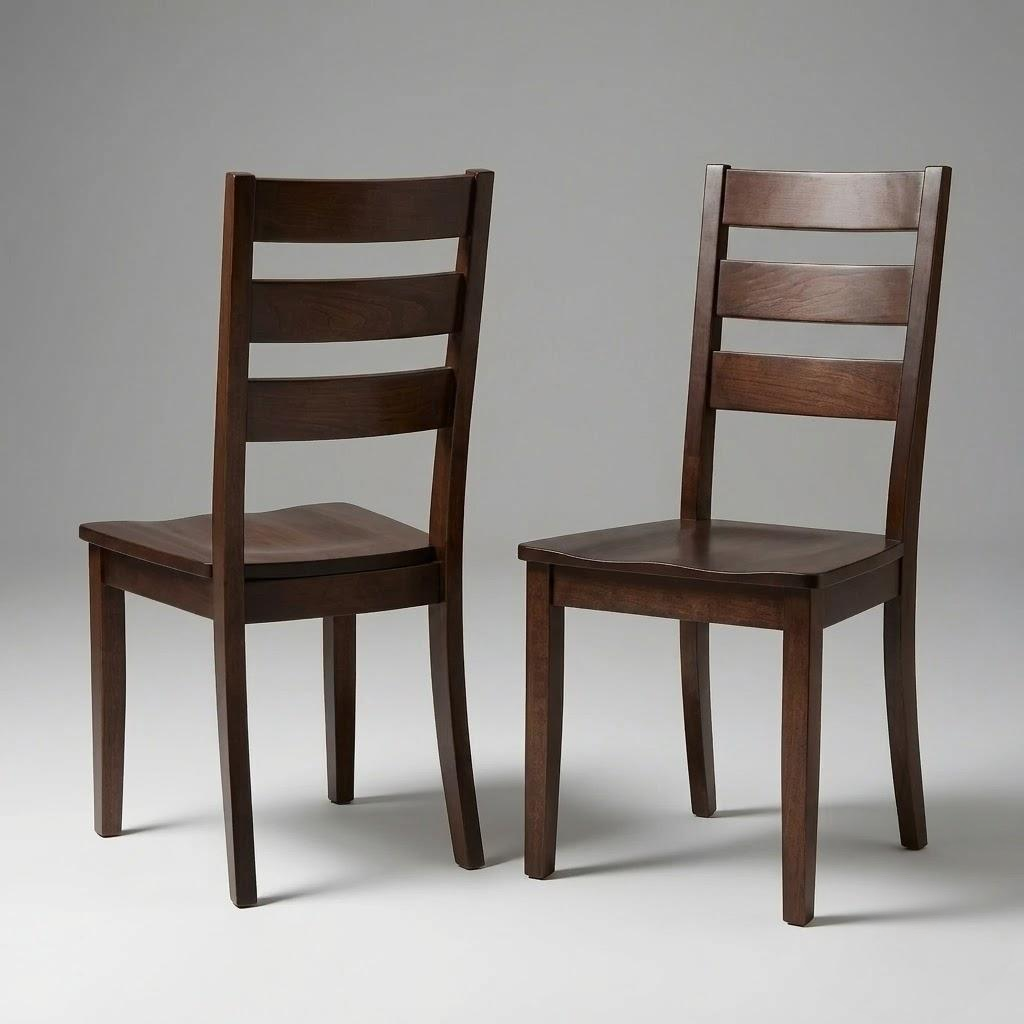 Two Dalton Chairs, handcrafted in the USA from solid hardwood with a dark brown, durable finish. Each chair features three horizontal slats on the backrest—one displays its front while the other is angled to reveal its back. The background is plain gray.