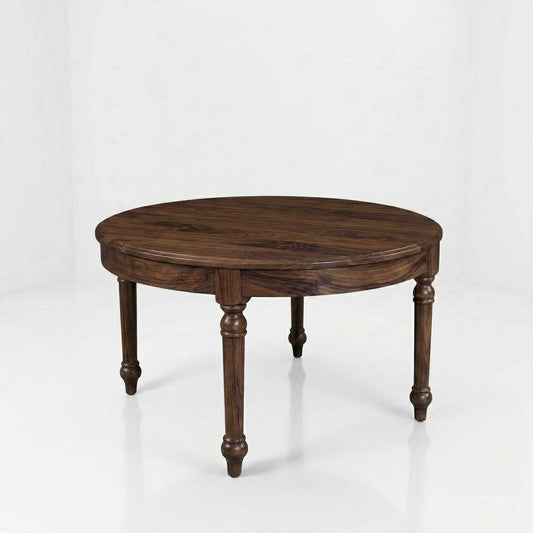 The Marcy Round Coffee Table, handcrafted in the USA from solid wood, features a dark finish and four carved legs, and is set against a plain white background.