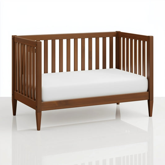 The Westcott crib converted into a toddler bed, on white.