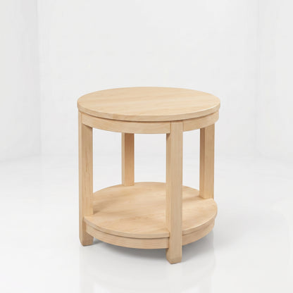 The Adams Round End Table is handcrafted from solid wood by skilled American craftsmen, featuring a light wood finish, four straight legs, a lower shelf, and a durable top coat—all set against a plain white background.