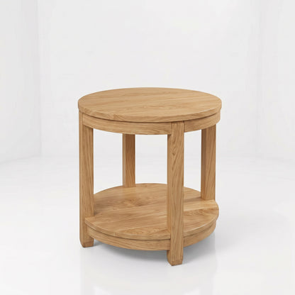 The Adams Round End Table, expertly handcrafted from solid wood by American craftsmen, features four legs and a lower circular shelf. Showcasing a simple, natural wood finish with visible grain patterns and a durable top coat for lasting beauty, this round side table is set against a plain white background.