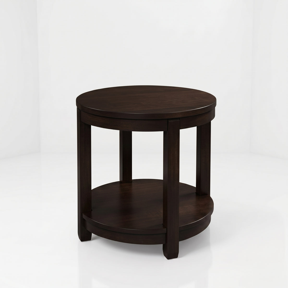 The Adams Round End Table, handcrafted by American craftsmen from solid wood, features a round silhouette in dark wood, four sturdy legs, a convenient lower shelf, and a durable top coat finish. It is showcased against a plain white background.