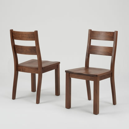 Two solid walnut handcrafted usa made custom wooden chairs on a light gray background