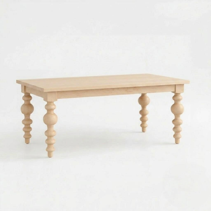 Introducing The Aubrey Dining Table: a handcrafted, solid wood dining table featuring a rectangular top and four ornate, spindle-shaped legs, made in the USA and showcased against a plain white background.