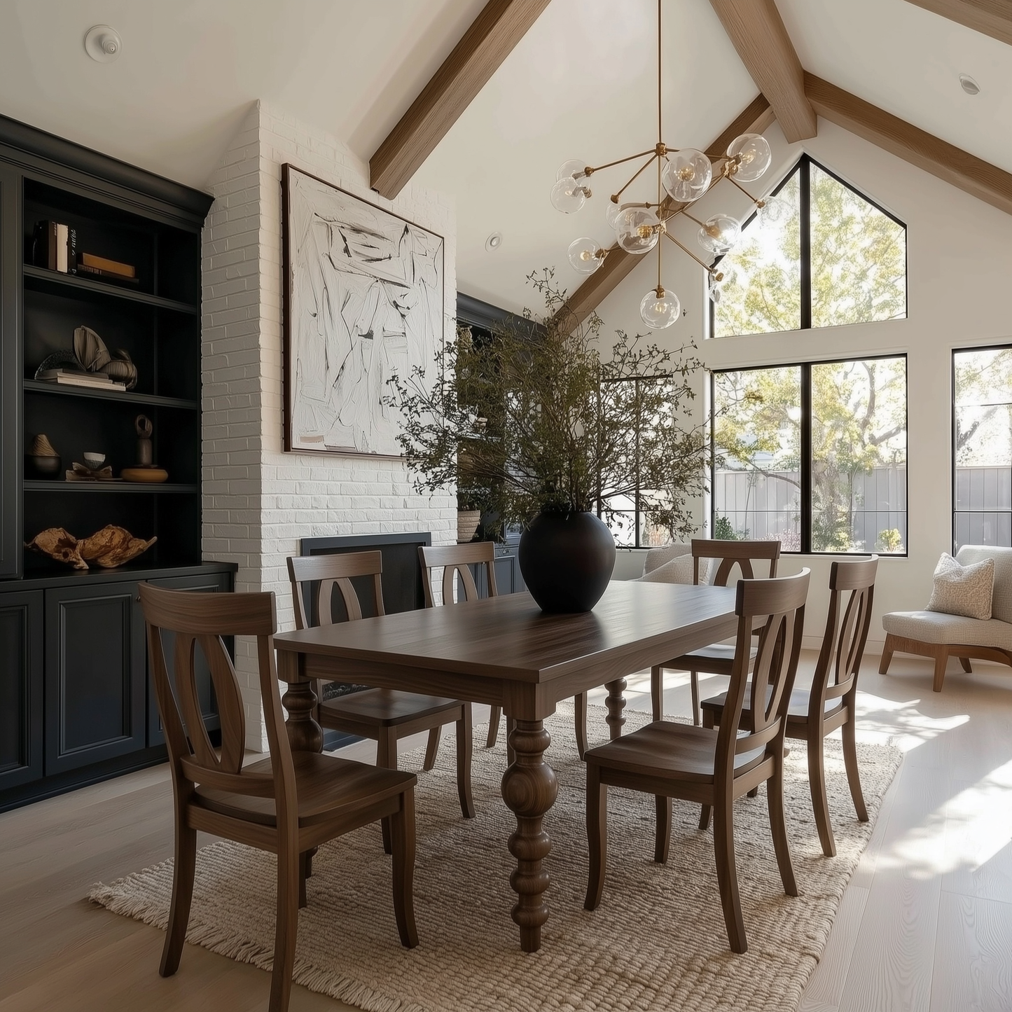 Modern bold turned legs, solid handcrafted usa made walnut dining table and matching chairs customized extendable. organic modern, large dark blue build-ins and white brick fireplace, vaulted ceilings. 