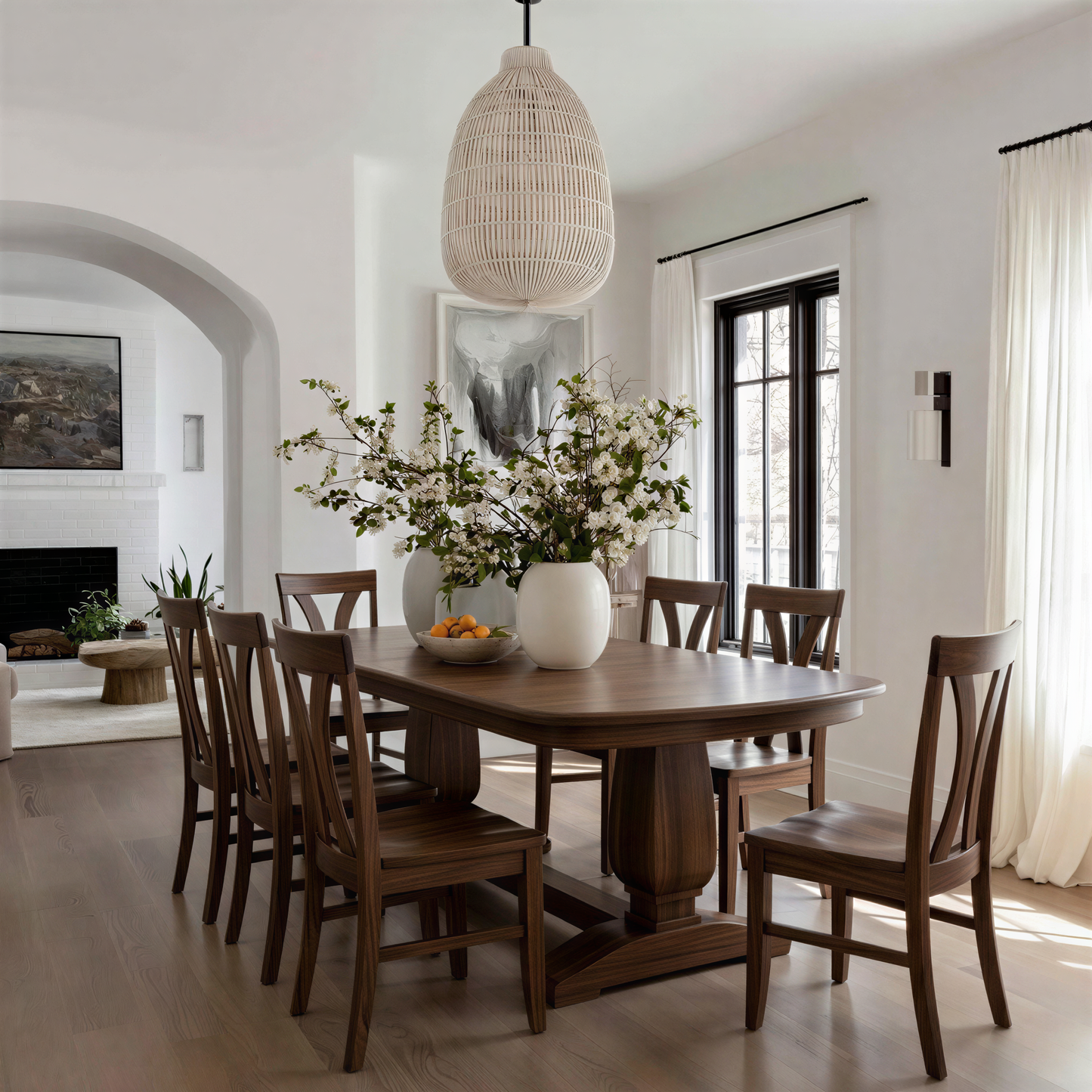 Dining room with wooden table and chairs, vase of flowers, and wicker pendant light.  usa custom solid walnut handcrafted dining table and chairs extendable.