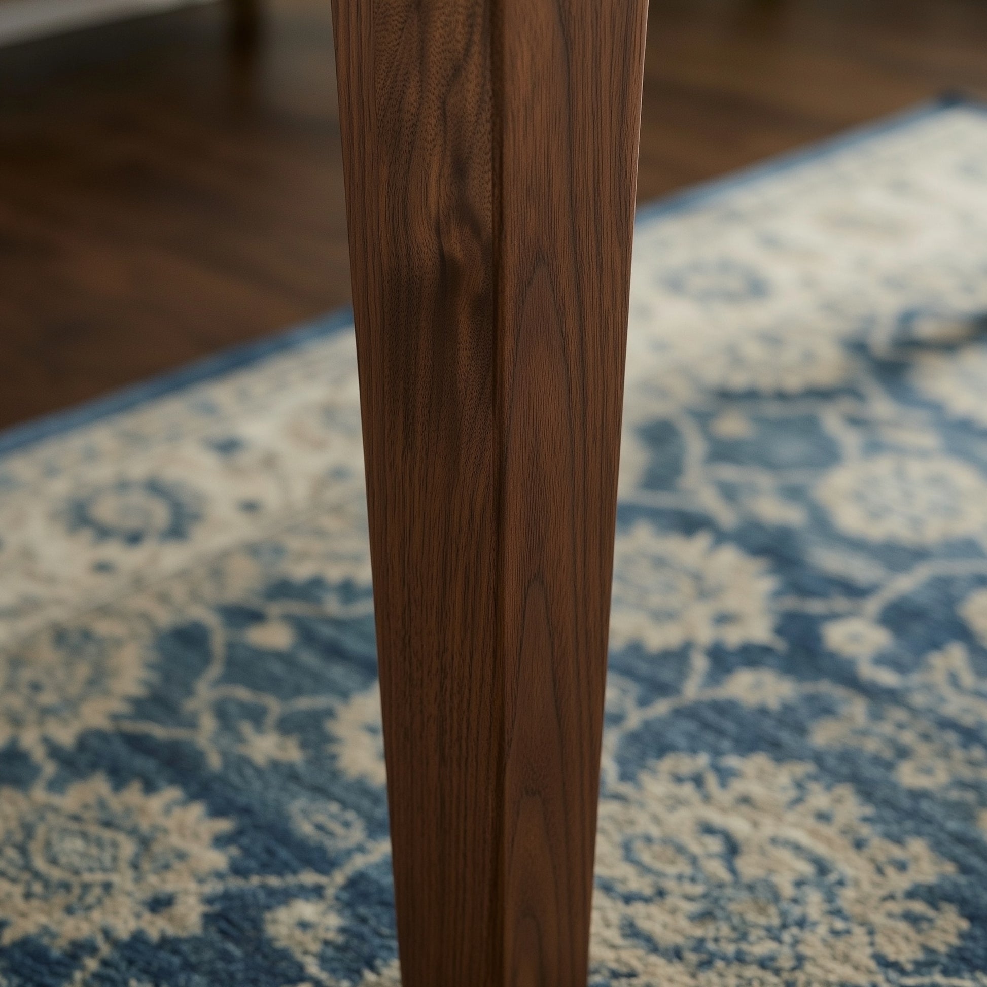 Close up image of the walnut legs on the brooks table

