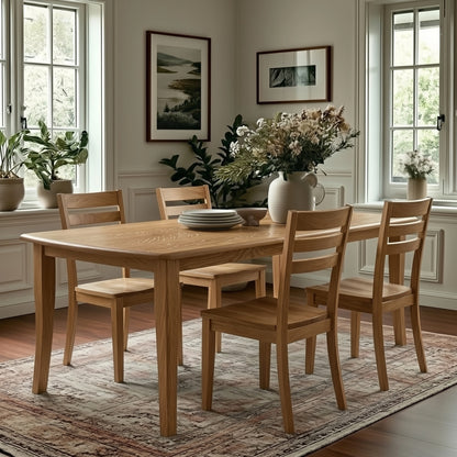 Quarter Sawn White Oak dining table with chairs in a well-lit room with large windows and decorative elements.