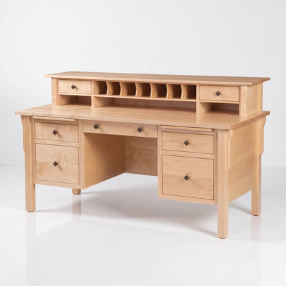 A light natural wood writing desk with a matching davenport-style hutch featuring multiple drawers, open cubbies, and a top shelf, photographed on a clean white studio background.