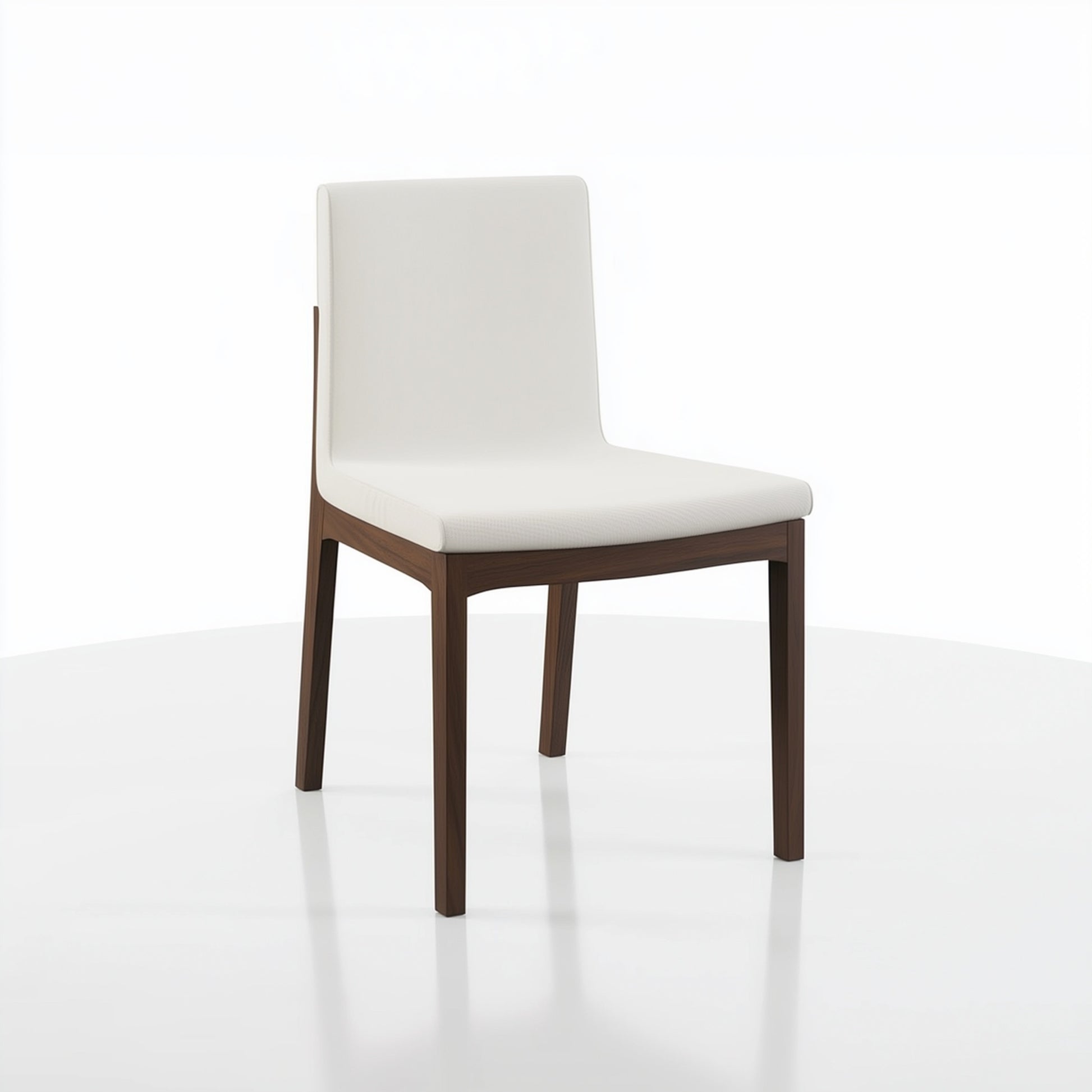The Carver Chair features a white cushioned seat and backrest with sleek dark wooden legs, displayed on a white surface against a plain white background.
