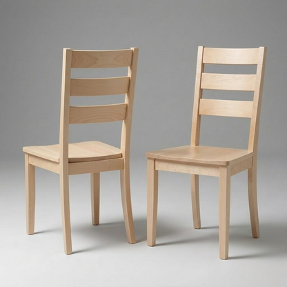 Two Dalton Chairs, handcrafted in the USA from solid hardwood with a light wood finish, are arranged on a plain gray background. One chair is positioned facing forward while the other is angled slightly to the side, showcasing both front and side views of this durable design.