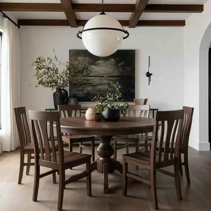 Dining room with wooden walnut usa made custom hardwood table and chairs, large round pendant light, and wall art. Modern organic with moody panting, walnut box beams. white draped