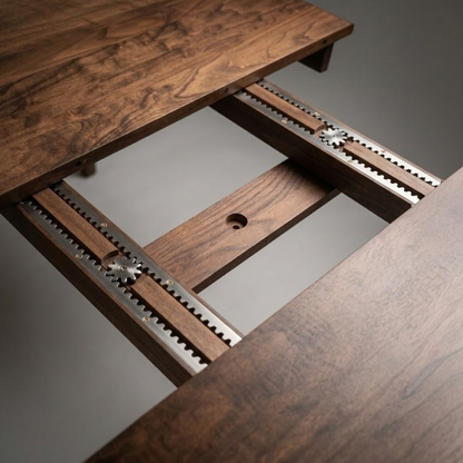 Close up image of the metal gears and mechanism that allows an expandable table to open.