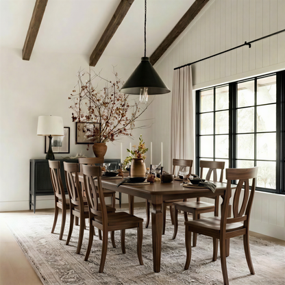 solid handcrafted hardwood walnut table and chairs usa made customizable extendable expandable corner legs heirloom in a dining room with windows.