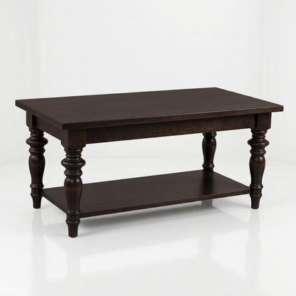 The Lincoln Rectangle Coffee Table, handcrafted from solid wood by skilled American artisans, features a dark wood finish, elegant turned legs, a spacious lower shelf, and a durable top coat—displayed on a white background.