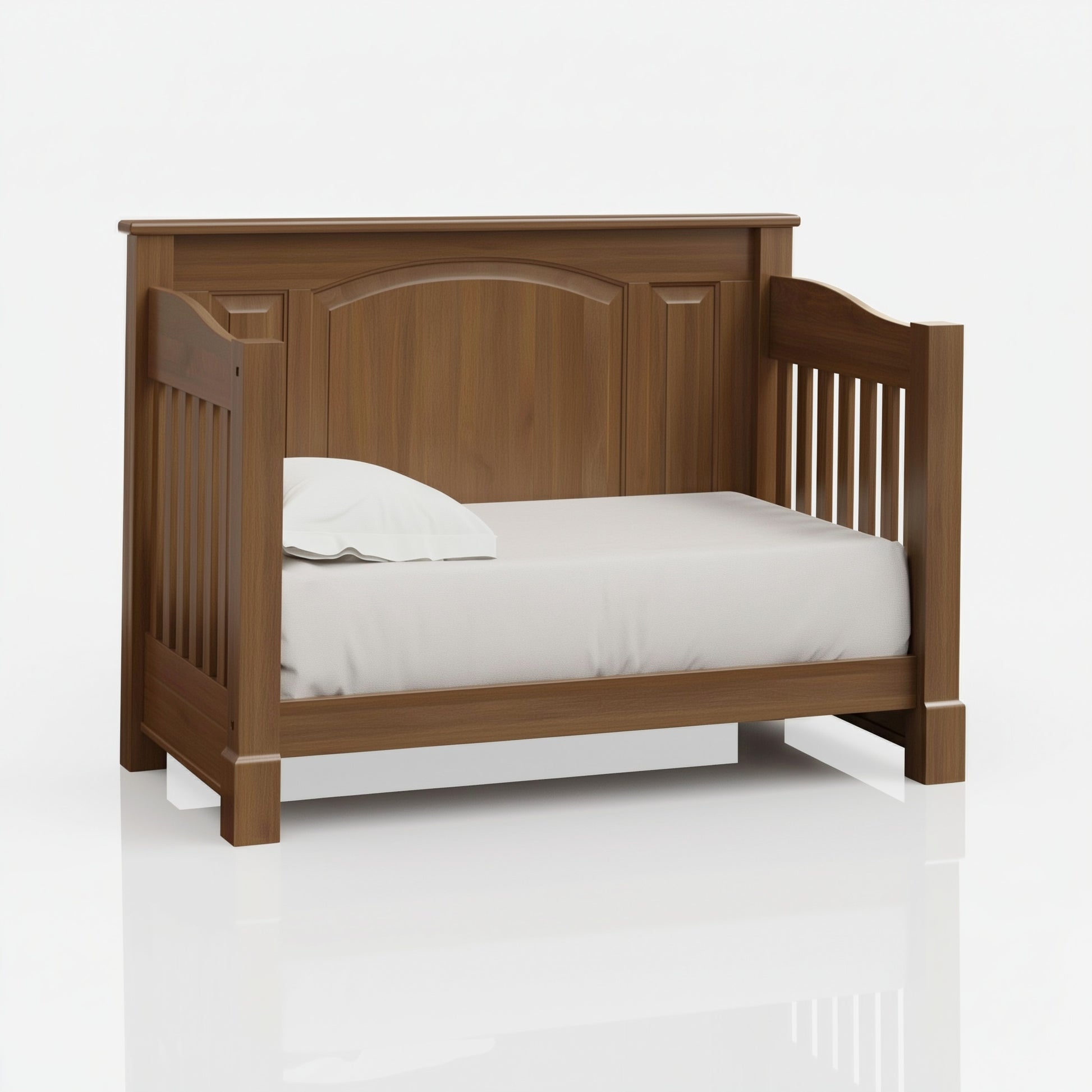 The macon crib converted into a toddler bed, on white. 