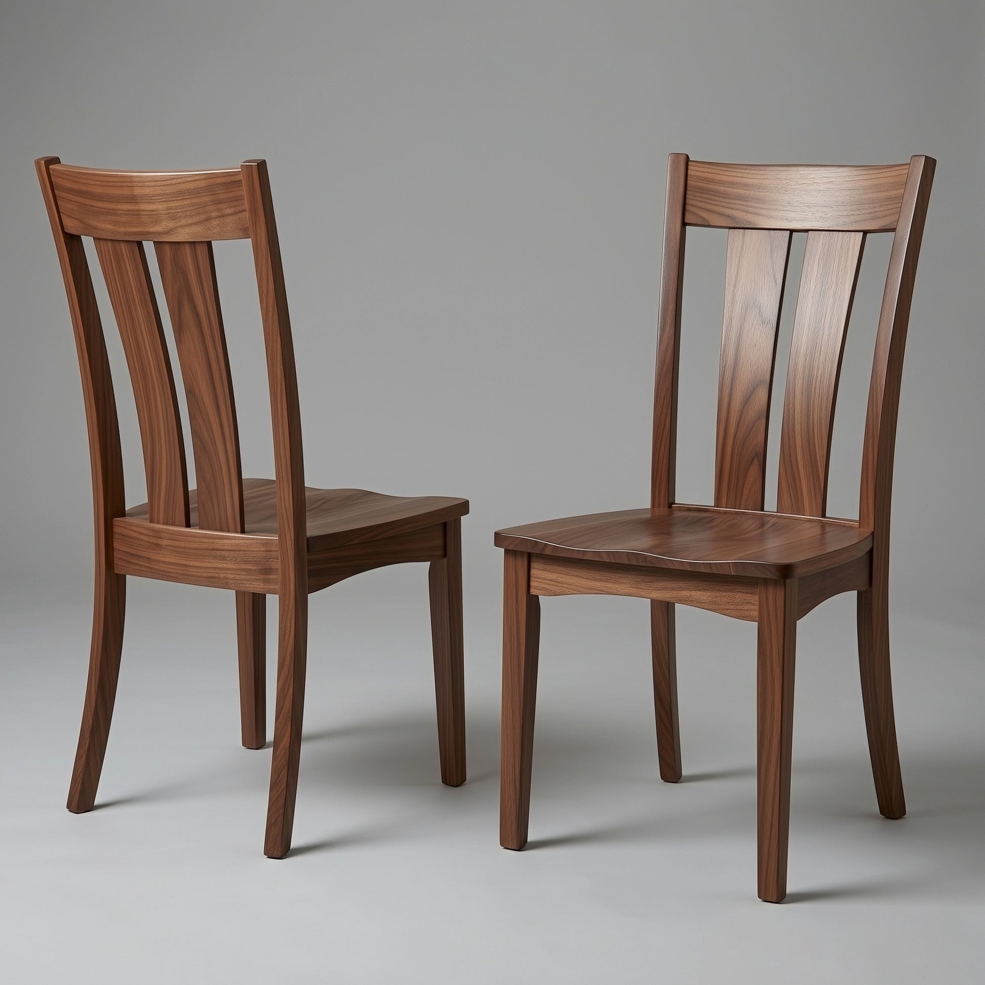 Two wooden solid walnut usa made custom chairs on a gray background