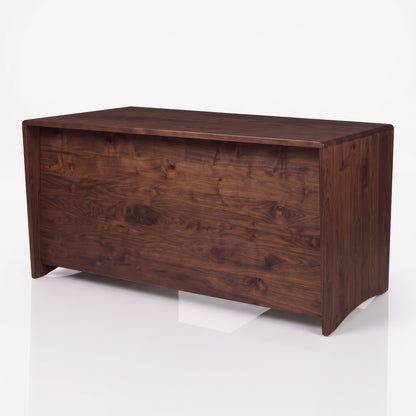 A rectangular wooden chest or bench with a rich dark brown walnut finish, shown from a three-quarter angle on a clean white studio background.