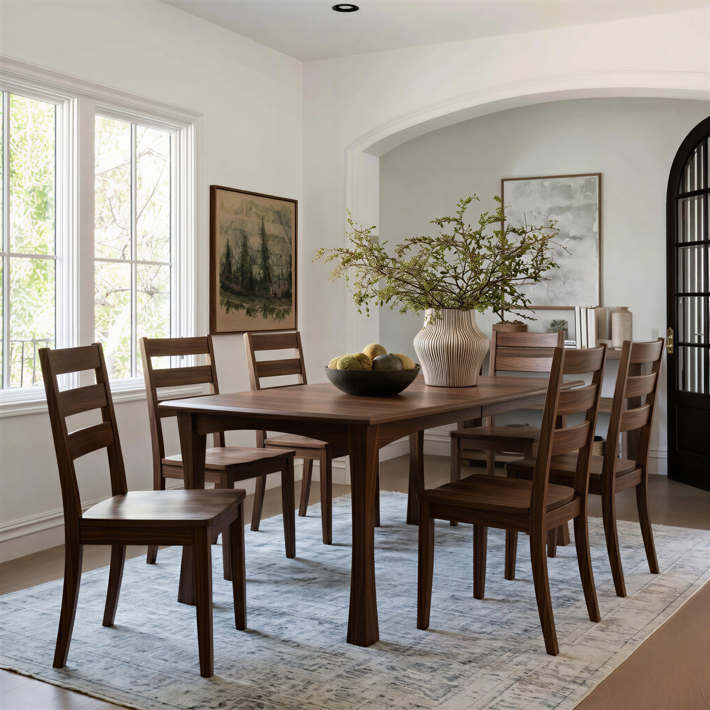 Dining room with wooden table and chairs in a well-lit room. Solid hardwood walnut usa handcrafted custom extendable american made.
