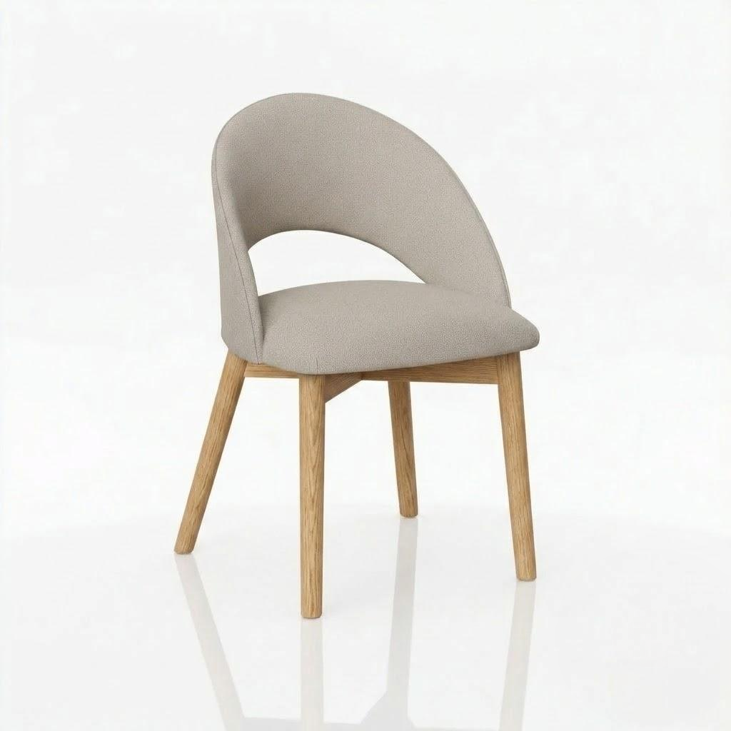 The Oakes Chair features a curved, upholstered beige seat and backrest paired with light solid hardwood legs, displayed against a plain white background.