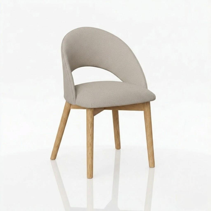 The Oakes Chair features a curved, upholstered beige seat and backrest paired with light solid hardwood legs, displayed against a plain white background.