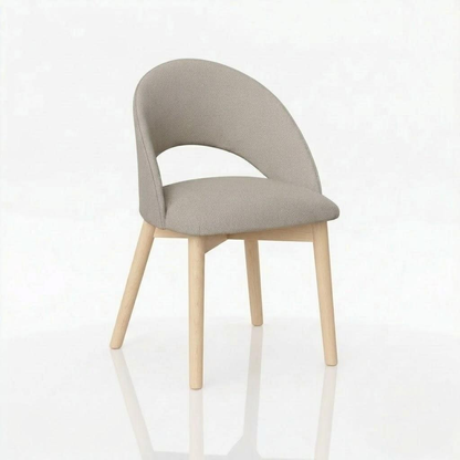 Introducing The Oakes Chair: a modern design handcrafted in the USA from solid hardwood, featuring light wooden legs and a gracefully curved, light gray upholstered seat and backrest—beautifully showcased against a plain white background.