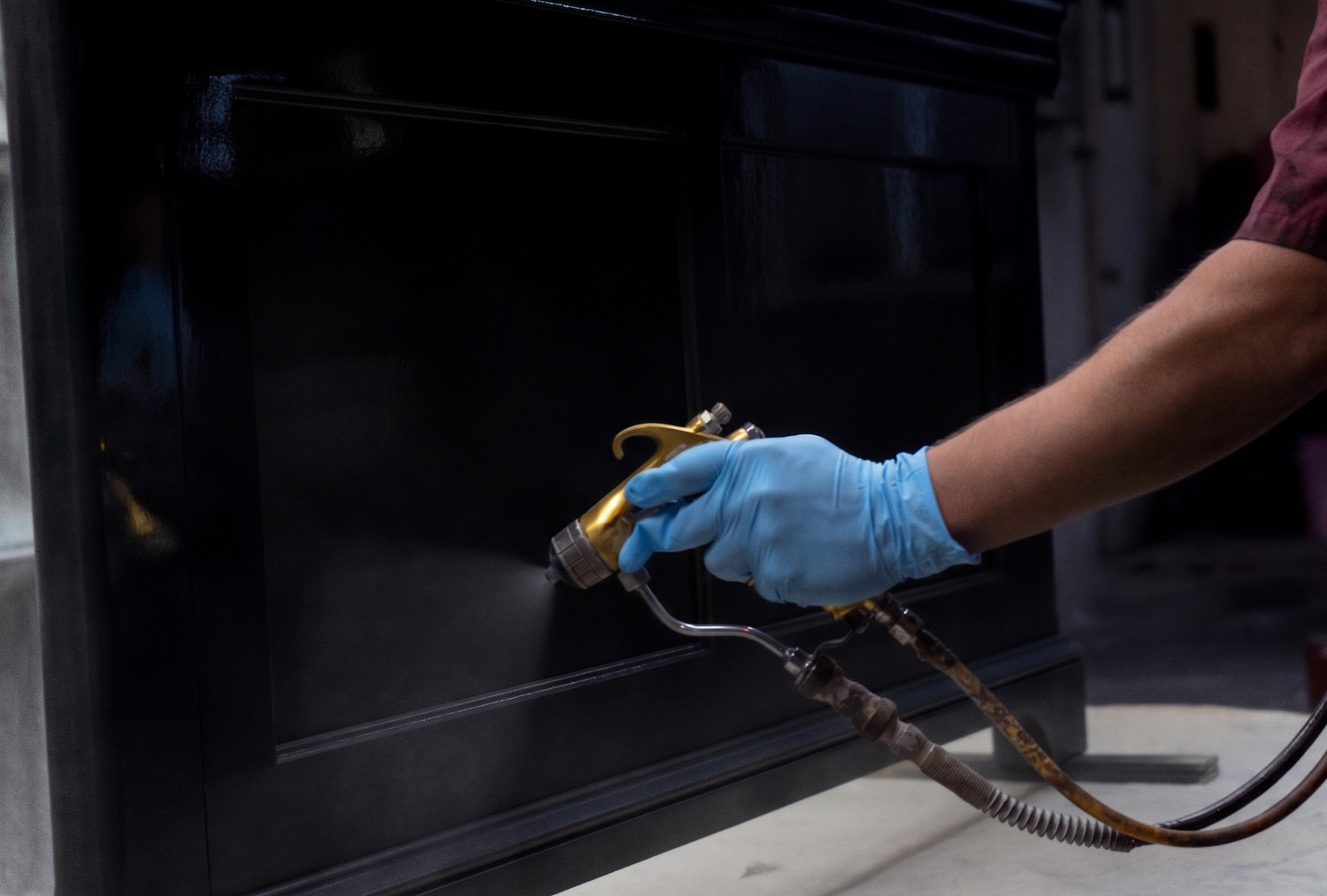 Applying a furniture finish with a sprayer