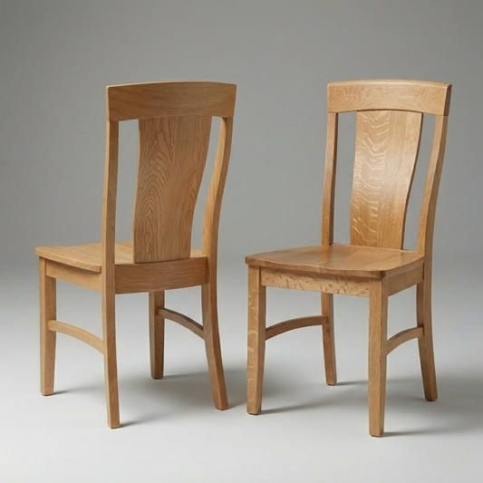 Two traditional panel back handcrafted usa American made hardwood quarter-sawn white oak dining wooden chairs on a gray background