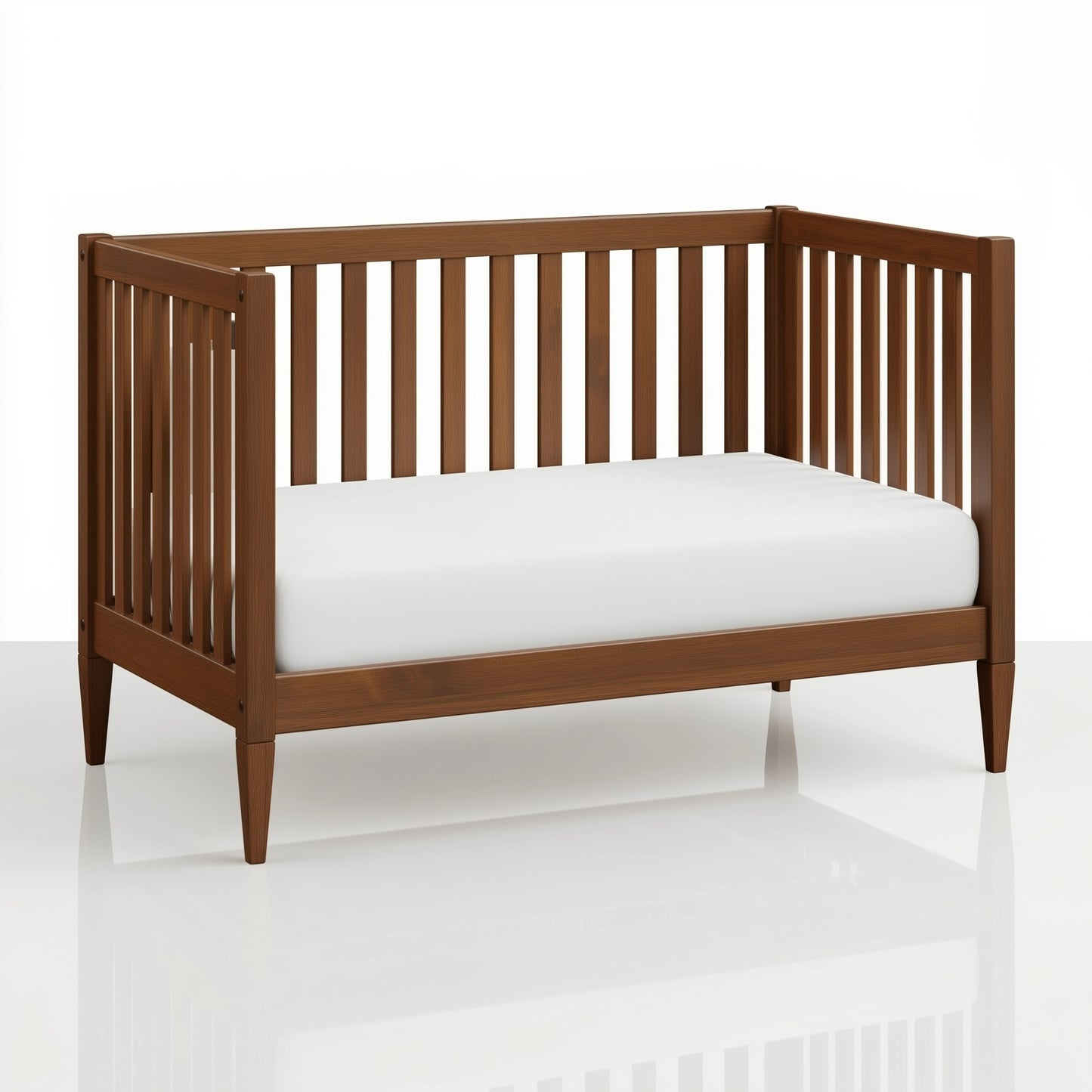 The Westcott crib converted into a toddler bed, on white. 