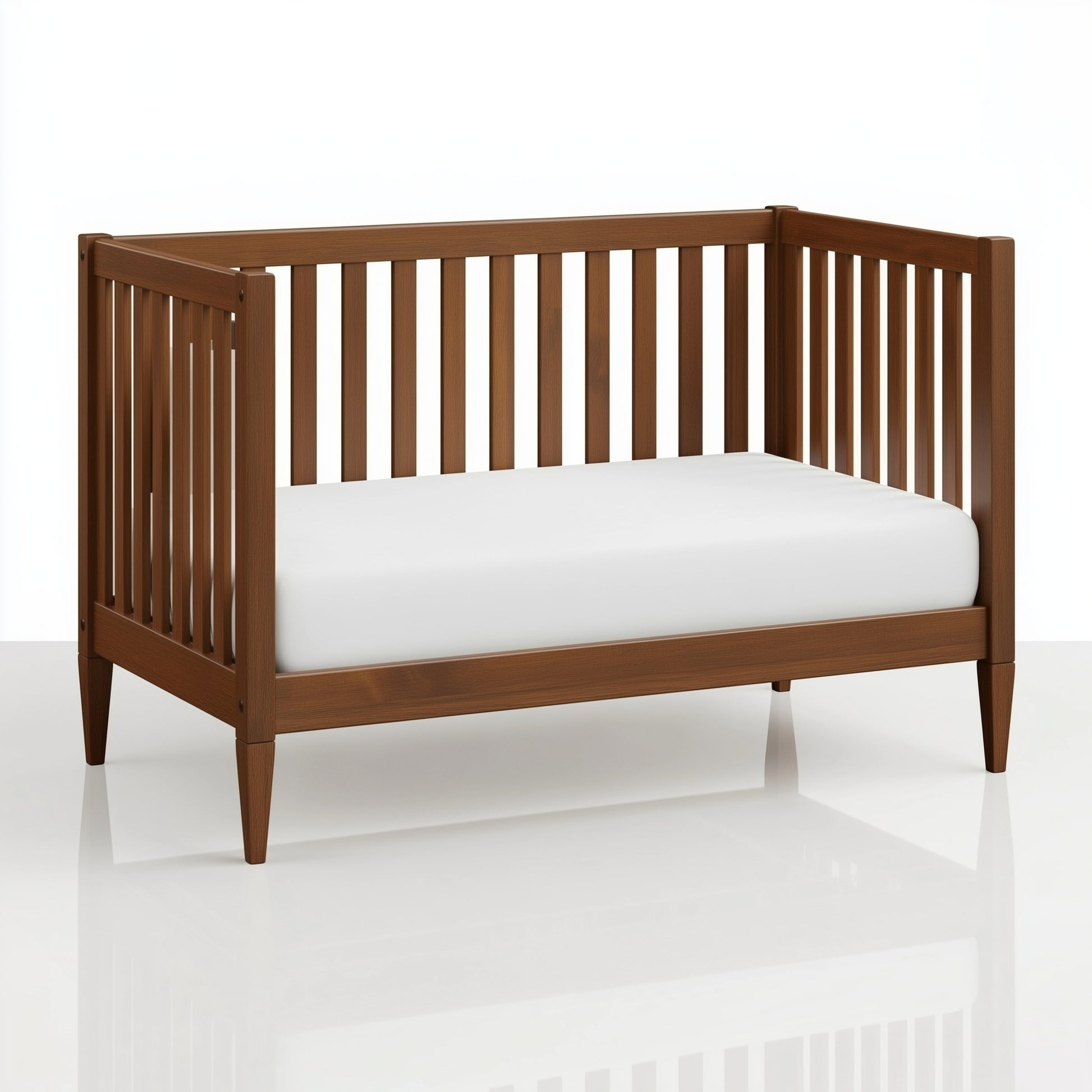 The Westcott crib converted into a toddler bed, on white. 