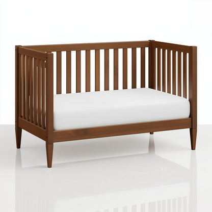 The Westcott crib converted into a toddler bed, on white. 