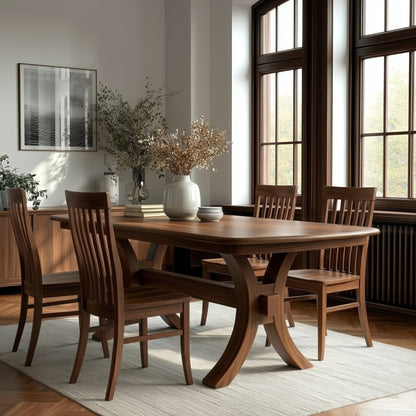Zara Walnut table with matching walnut chairs solid wood handcrafted bench built in usa, white rug, dark wood window frames. modern feel